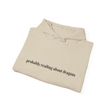 Probably reading about dragons... Hooded Sweatshirt